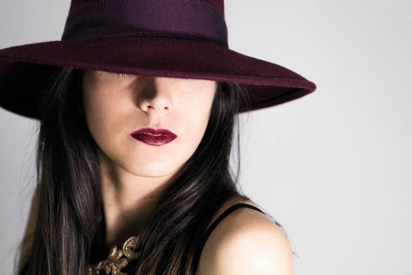 woman with burgundy hat