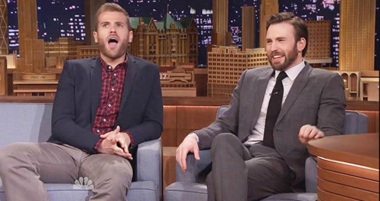 Chris and Scott Evans are sitting next to each other on The Tonight Show.