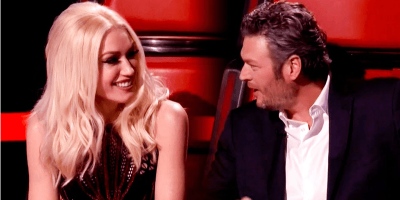 Gwen Stefani and Blake Shelton looking at each other on The Voice.