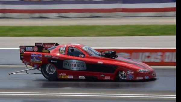 A 2013 Monte Carlo dragster racing on the track