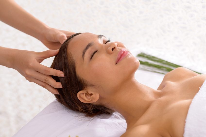 young woman enjoying scalp massage