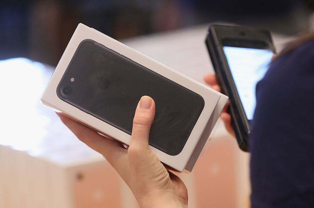 An Apple employee prepares Apple iPhone 7 phones