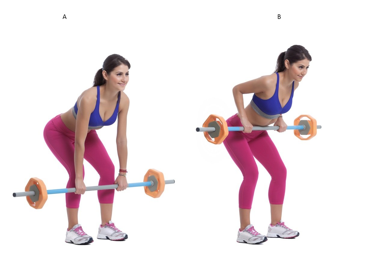 A woman does barbell rows