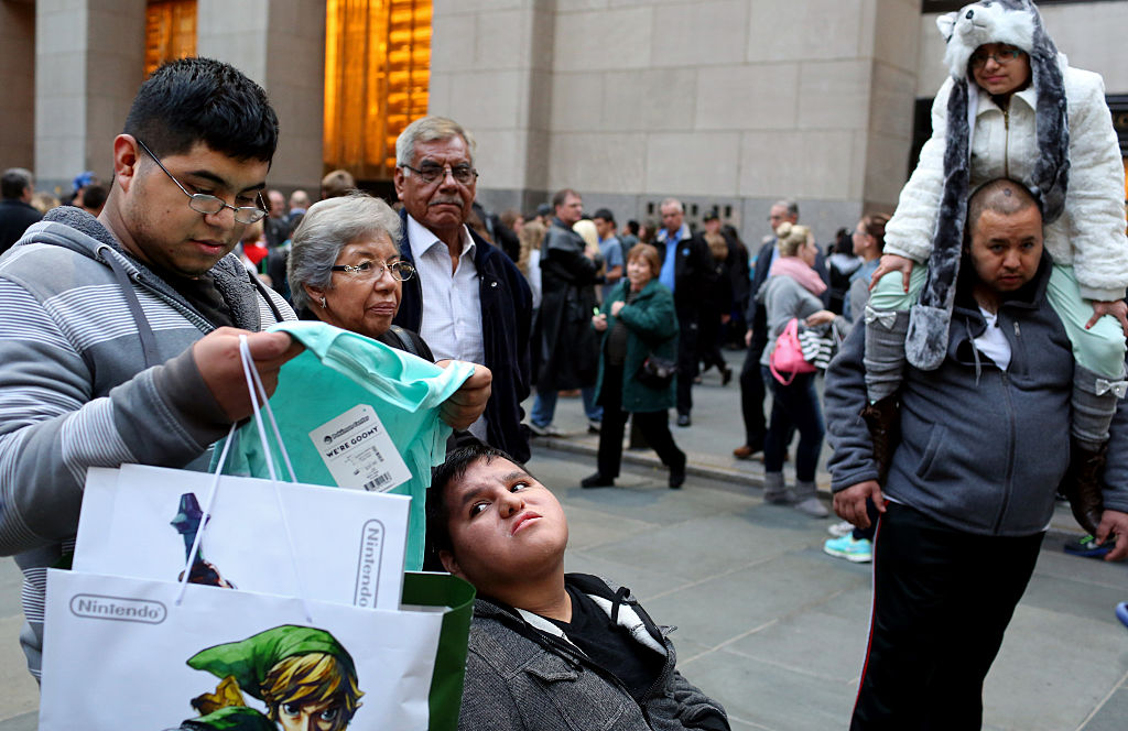 Shoppers walk through Rockefeller Center in New York City