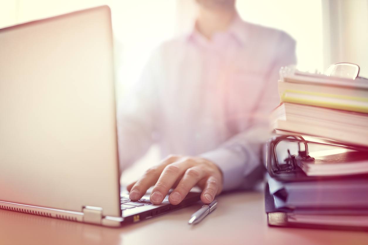 Businessman or designer using laptop computer