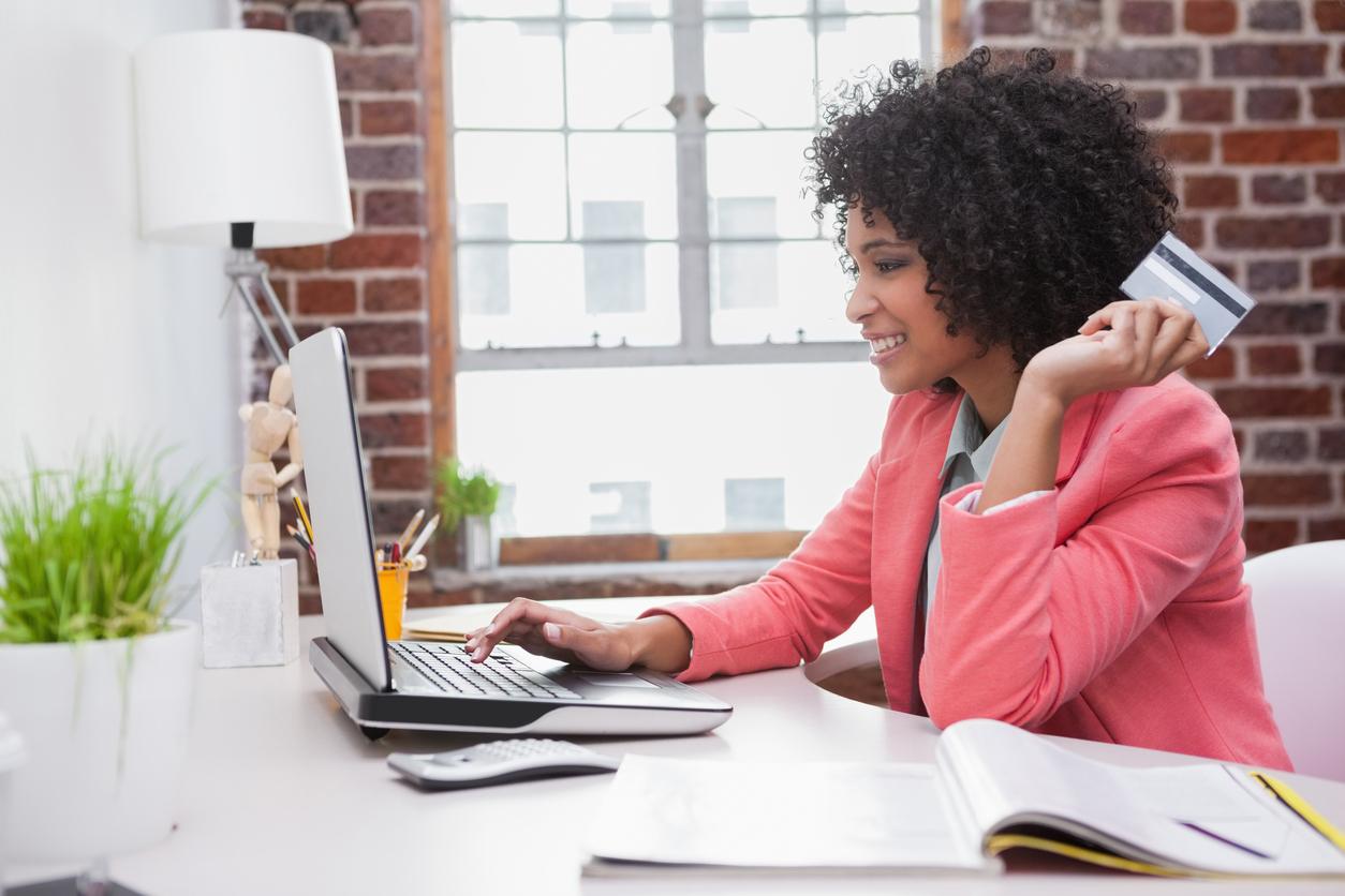 woman with credit card and computer