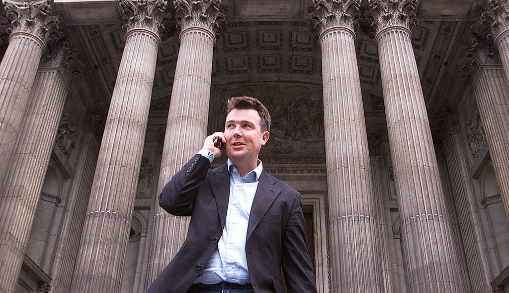 An unidentified businessman uses his cell phone May 22, 2002 in London, England