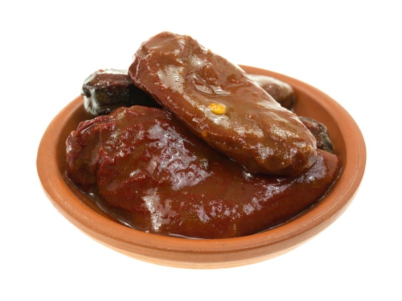 A small dish with chipotle peppers in adobo sauce