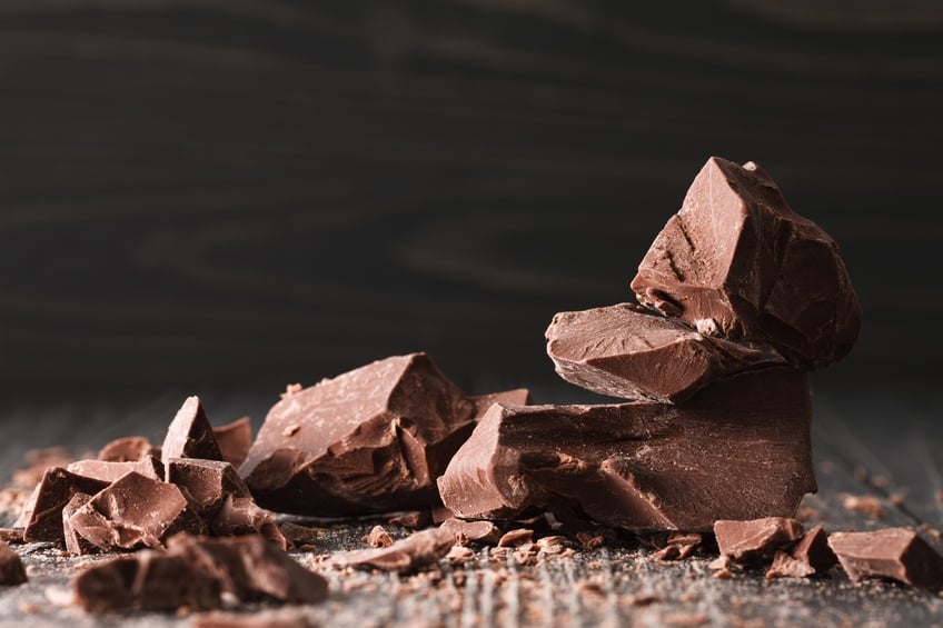 chocolate pieces on a dark wooden