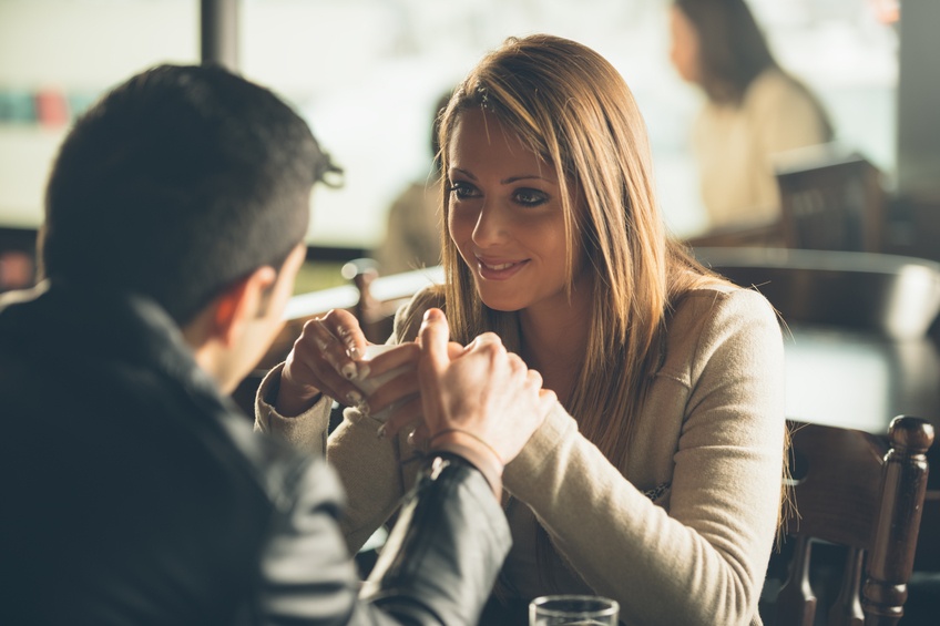 couple at the bar having a coffee
