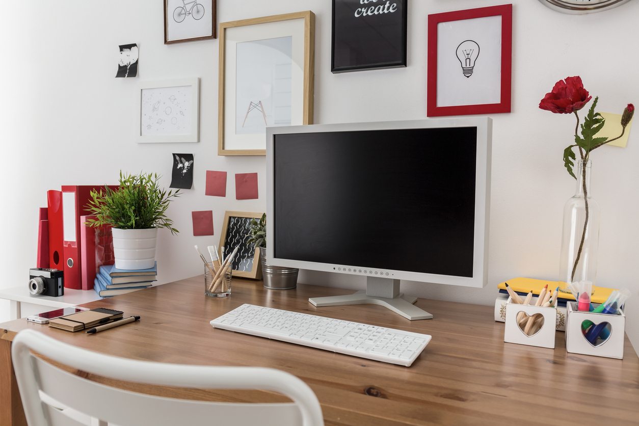 desktop computer on wooden desk