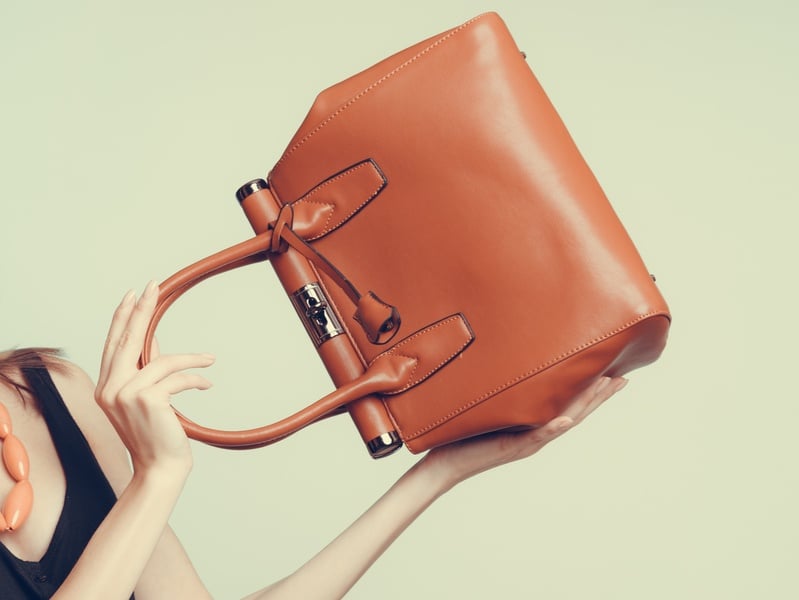 Girl holding brown bag