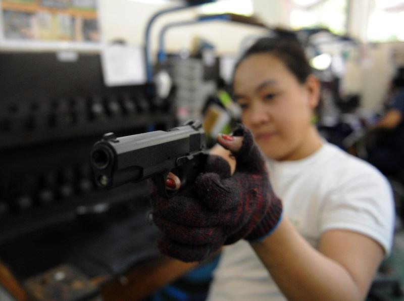A worker in a gun factory