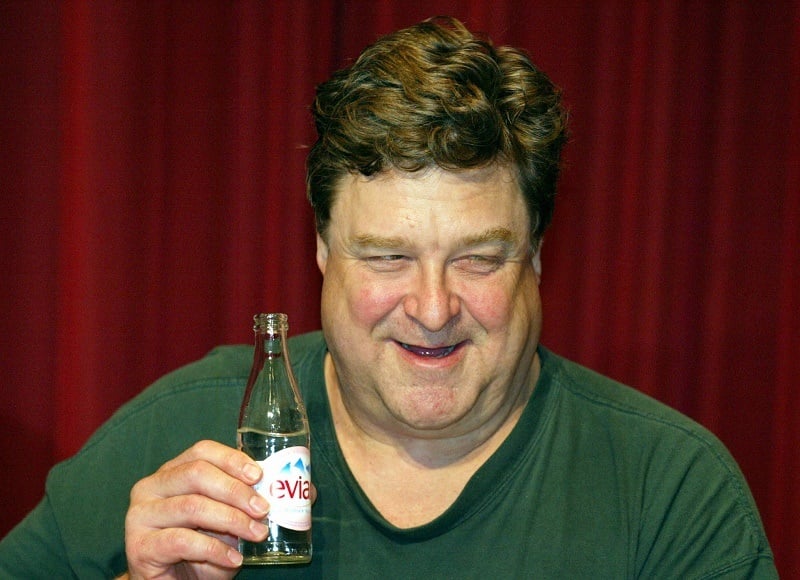 POTSDAM, GERMANY: US actor John Goodman holds a bottle of water during a press conference at Studio Babelsberg in Potsdam, 20 November 2003. Goodman shoots the movie "Beyond The Sea" a biographic picture about the late '50s rock and roll singer Bobby Darin.