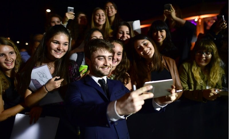At the Zurich Film Festival, Daniel Radcliffe enjoys a moment with fans.