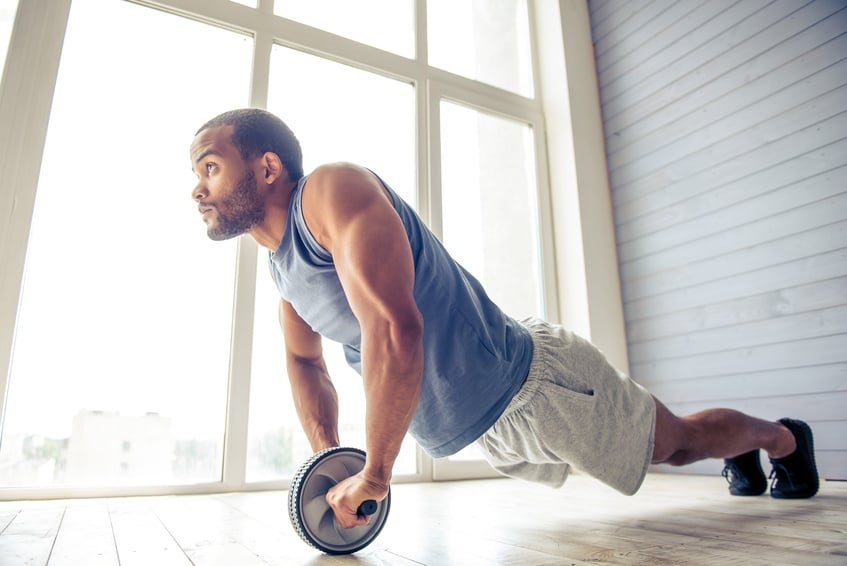Man doing an ab wheel rollout