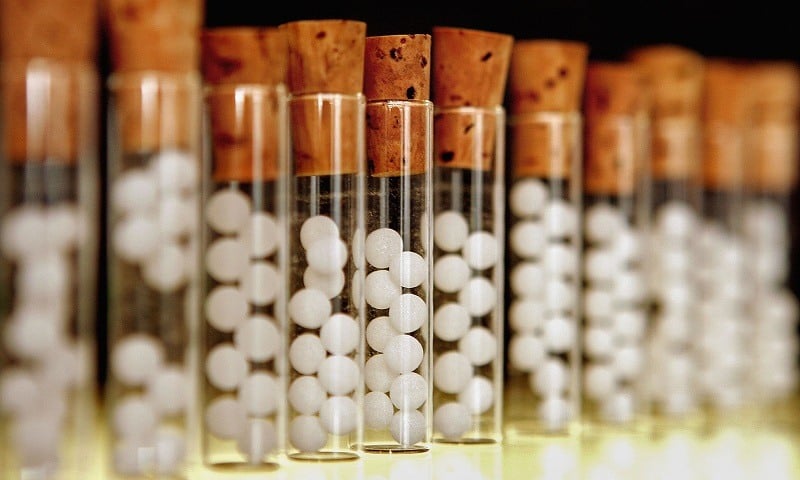 Vials containing white pills