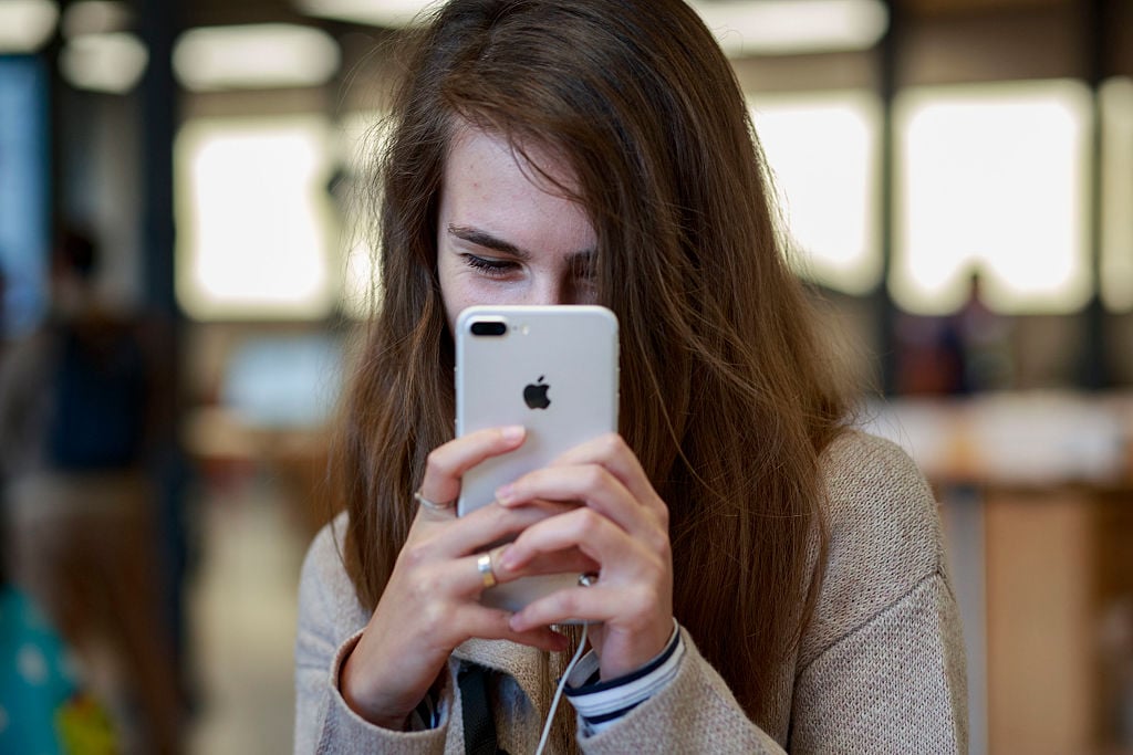 A customer takes a selfie with a new Iphone 7 exhibited at Puerta del Sol Apple Store
