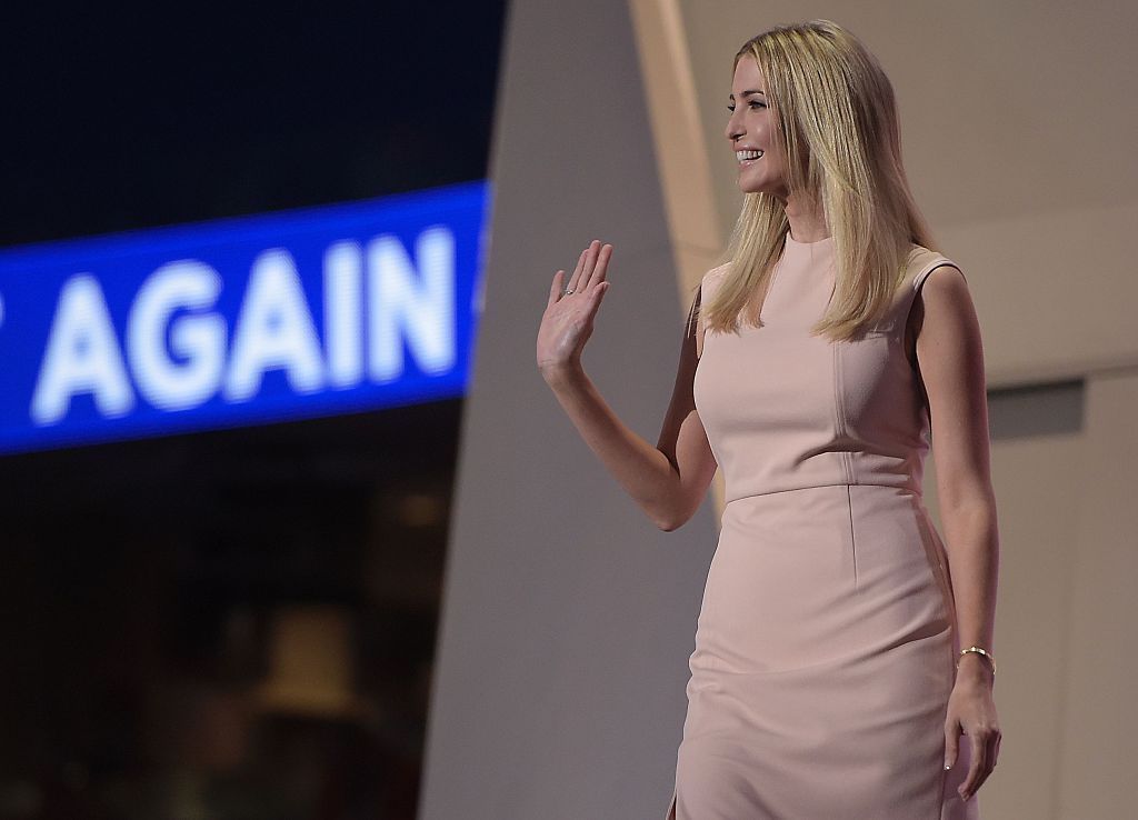 Ivanka Trump smiling and waving on stage. Ivanka Trump smiling and waving on stage.