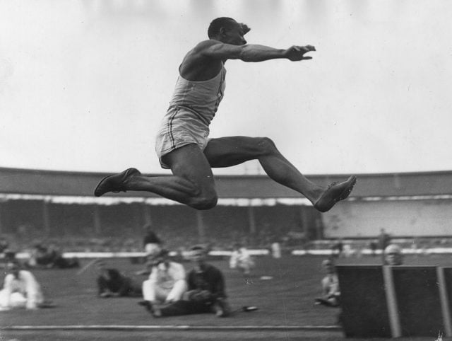 American athlete, Jesse Owens takes part in the long jump event in a USA versus British Empire American athlete, Jesse Owens takes part in the long jump event in a USA versus British Empire