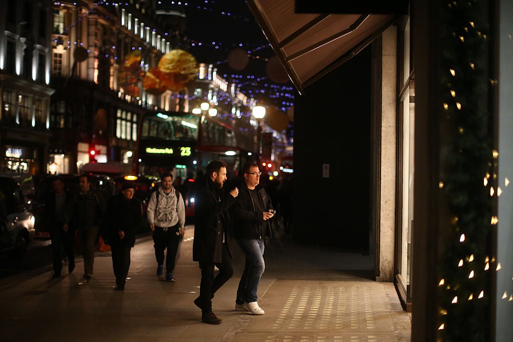 Men enter a luxury goods shop