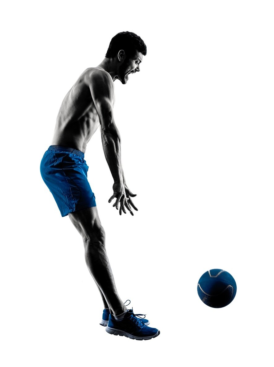 A man throws a medicine ball