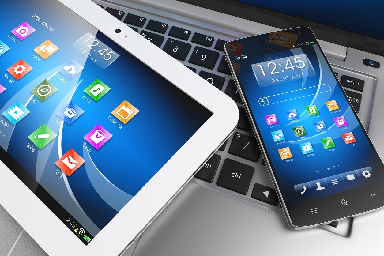 Mobile devices. Tablet PC, smartphone on laptop