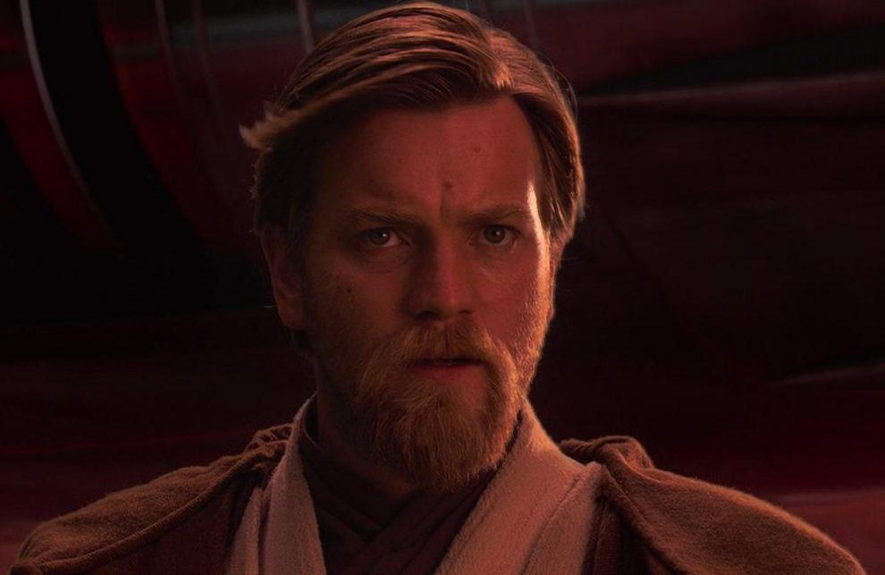 Obi-Wan Kenobi standing in a dimly lit room.