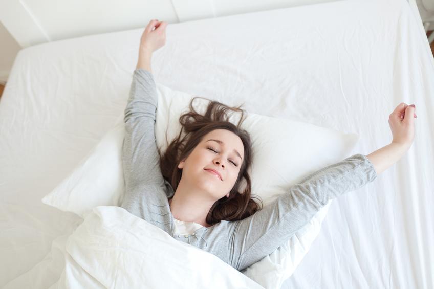 woman waking up in bed