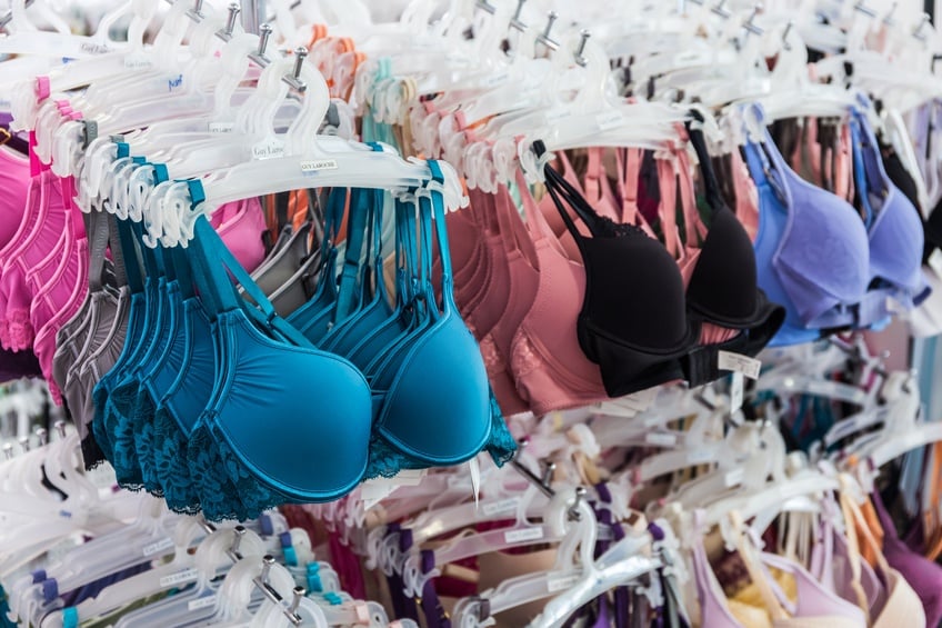 colorful bras hanging in lingerie store