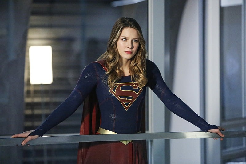 Melissa Benoist's Kara/Supergirl stands behind a desk in Supergirl Season 2