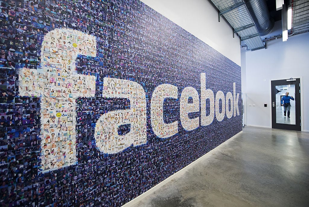 A big logo created from pictures of Facebook users worldwide is pictured in the company's Data Center