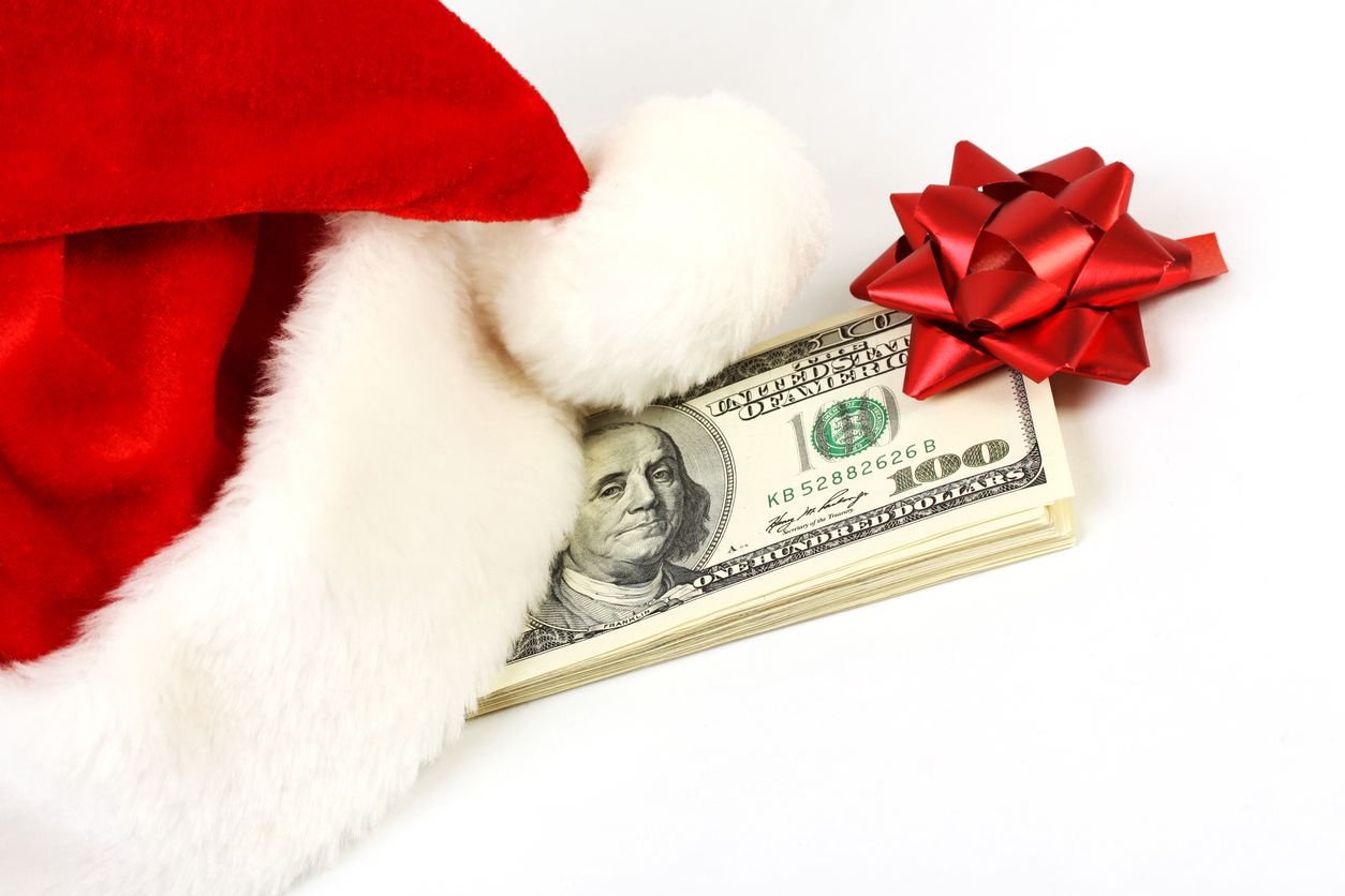 stack of money with a bow on it for holiday tipping