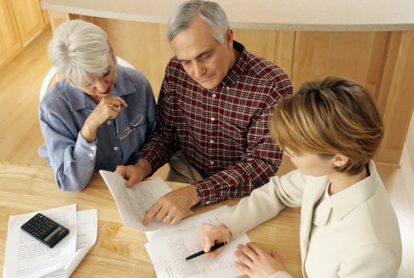 couple talking to financial planner at home