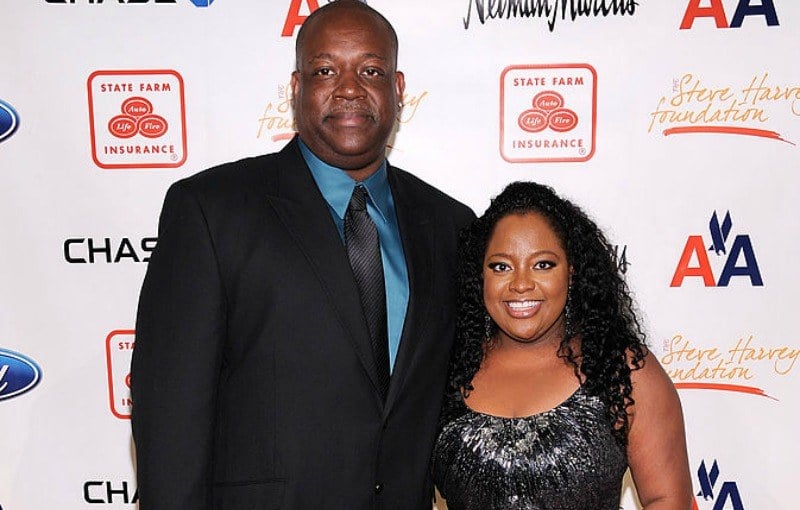Lamar Sally and Sherri Shepherd pose for photos at a black tie event.