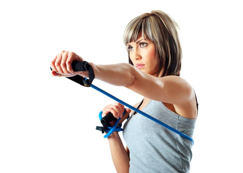 woman using resistance bands to make punching harder