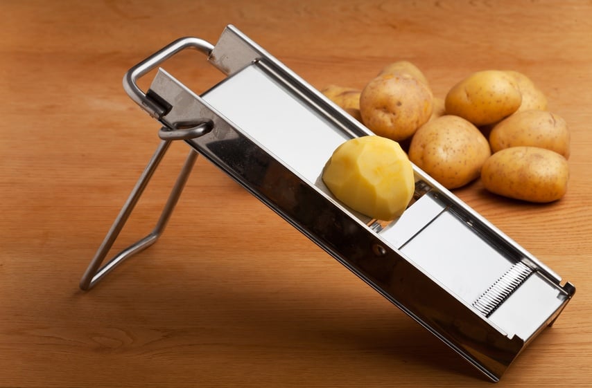 potato on a mandolin slicer