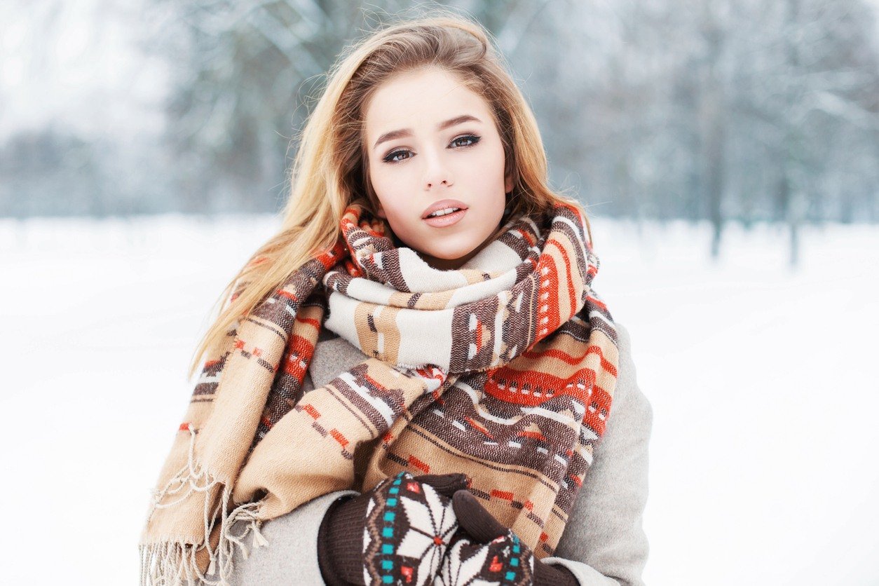 Girl in fashionable clothes with a scarf