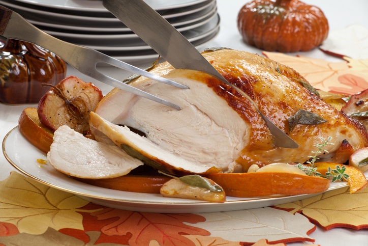 honey butter rub turkey breast garnished with roasted pumpkin