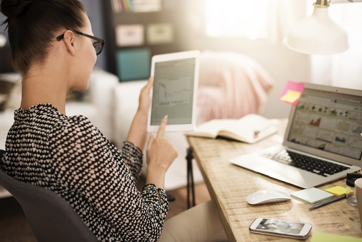 Woman analyzing some very important data on tablet