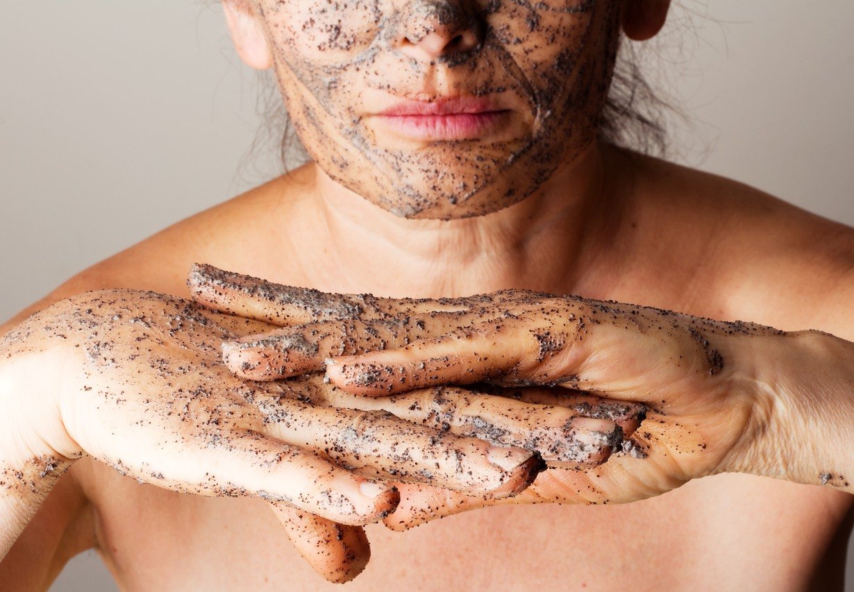 Mature woman making cosmetic mask from coffee