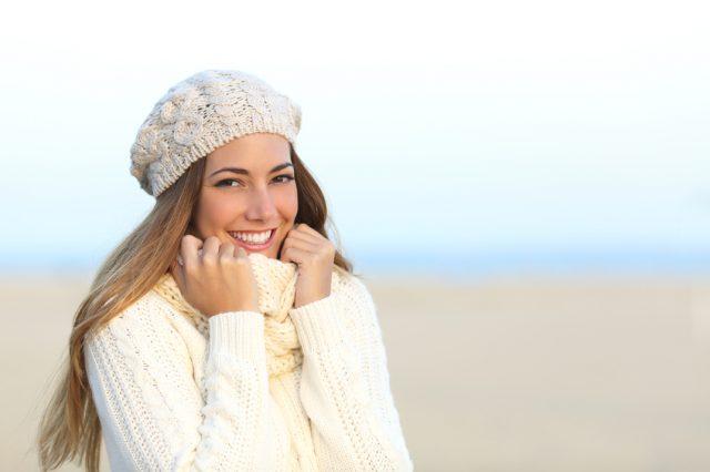 Woman wearing a warm sweater in a cold winter Woman wearing a warm sweater in a cold winter