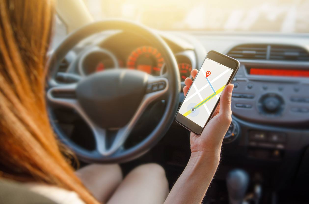woman using navigation or gps on mobile smartphone