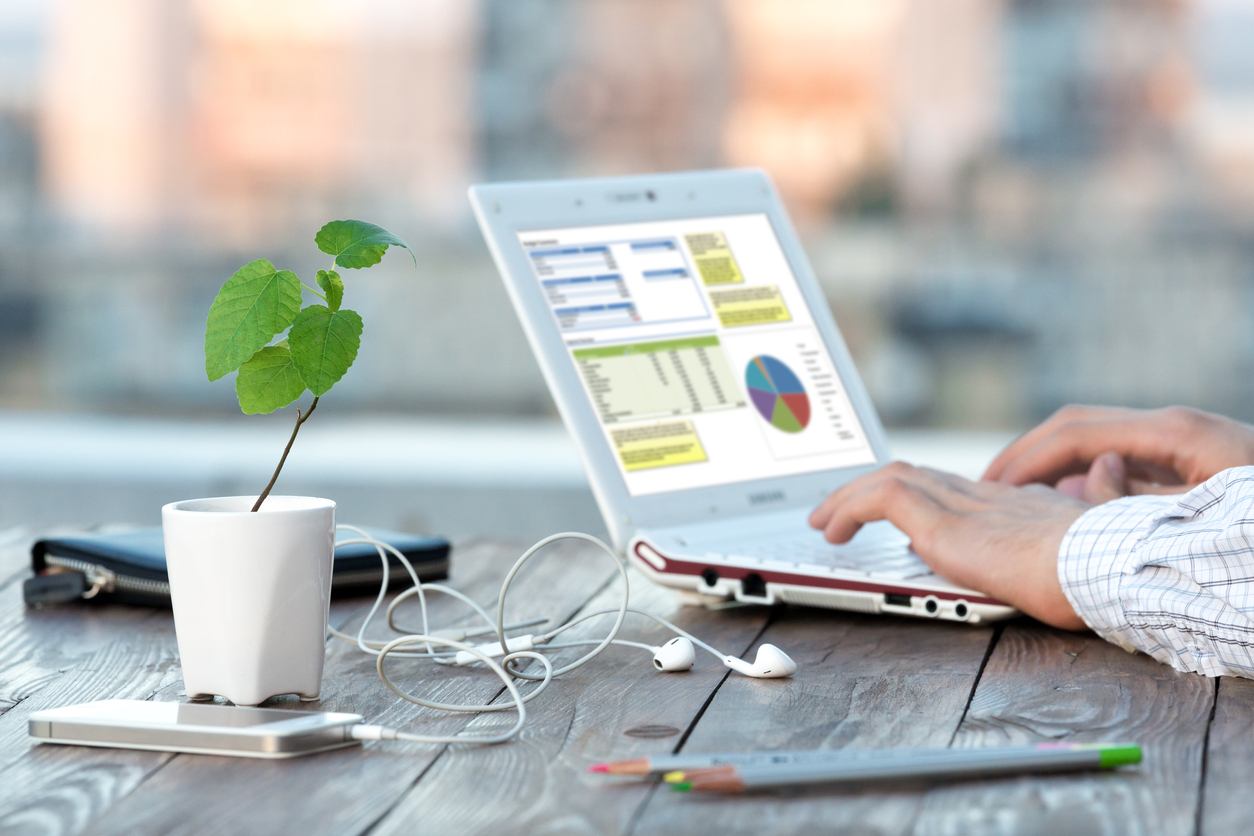 Hands of Person smart casual clothing typing on Laptop