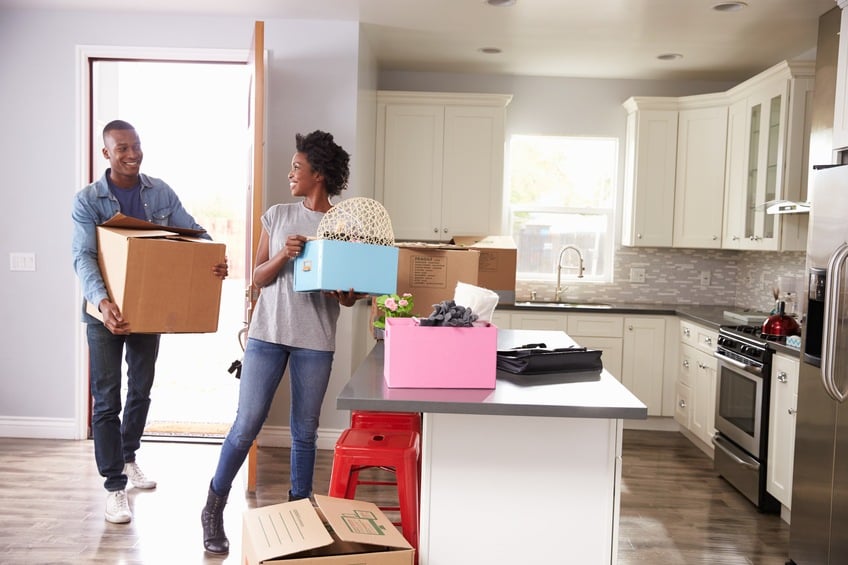 couple unpacking in new home