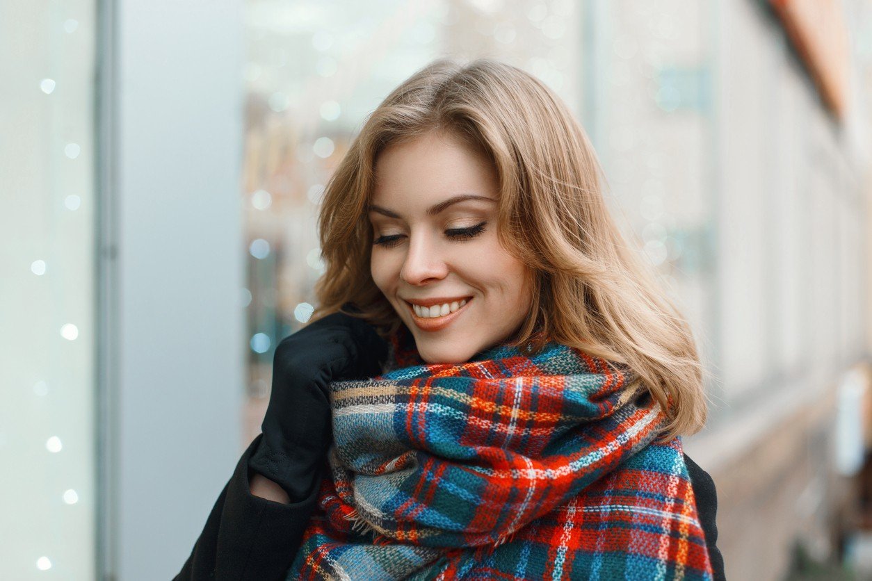 Young beautiful girl with a smile in vintage scarf