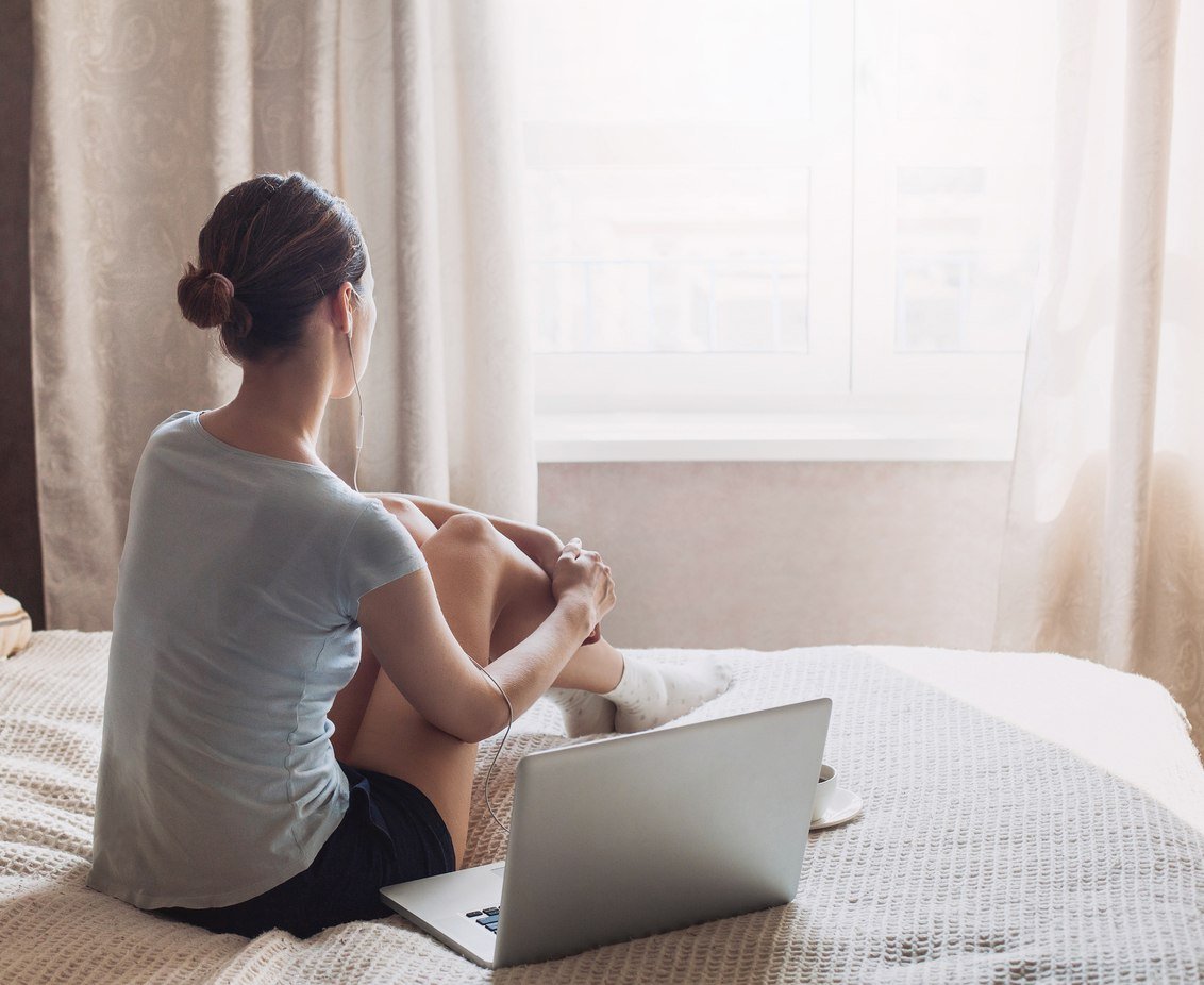Tired young woman working at home