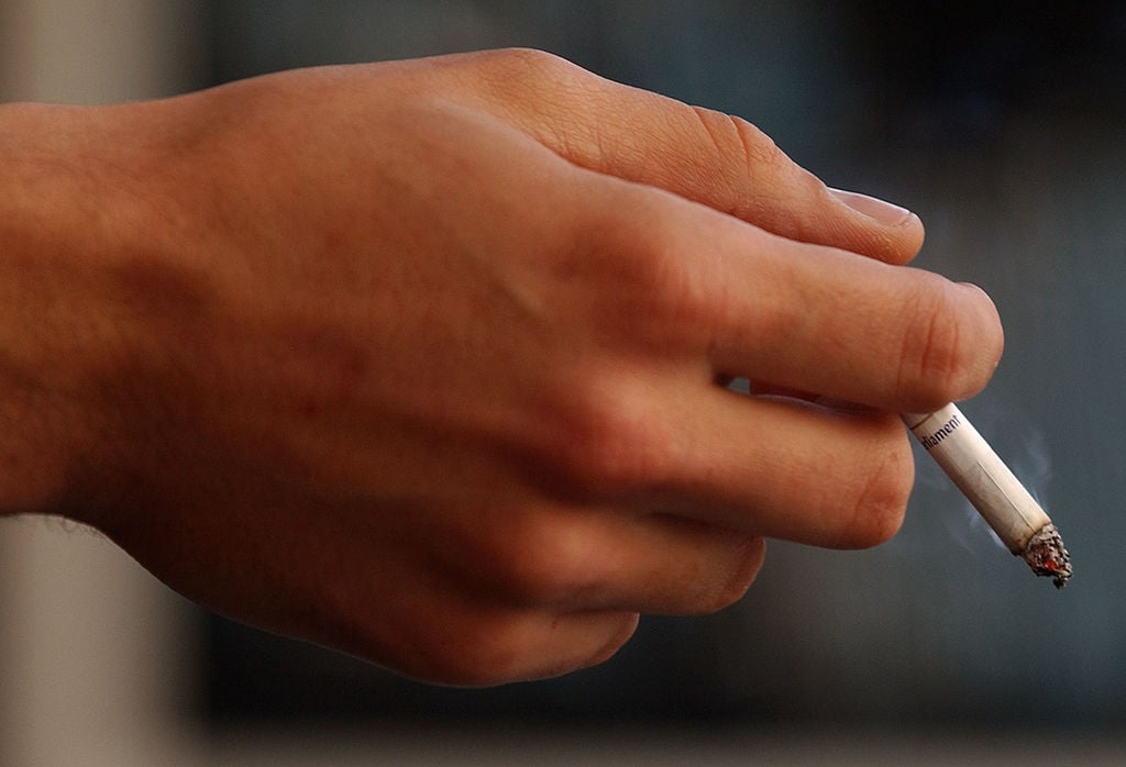 hand holding a cigarette