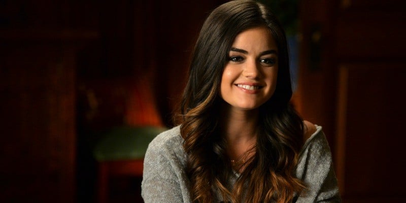 Aria is smiling in Pretty Little Liars.
