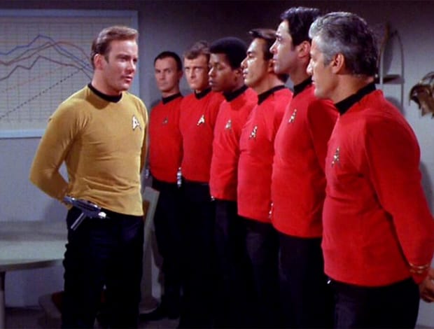 Captain Kirk and the "redshirts" Captain Kirk (William Shatner) stands before a line-up of crewmen in red shirts in a scene from 'Star Trek'